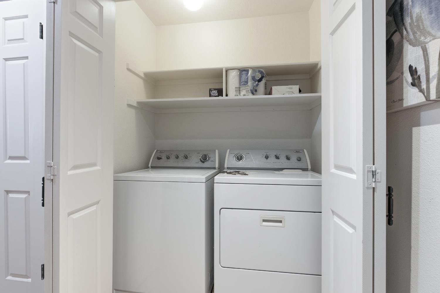 1833 Edgebrook Drive, Unit A Modesto, CA 95354 - Photo 35 of 43 a utility room with dryer and washer