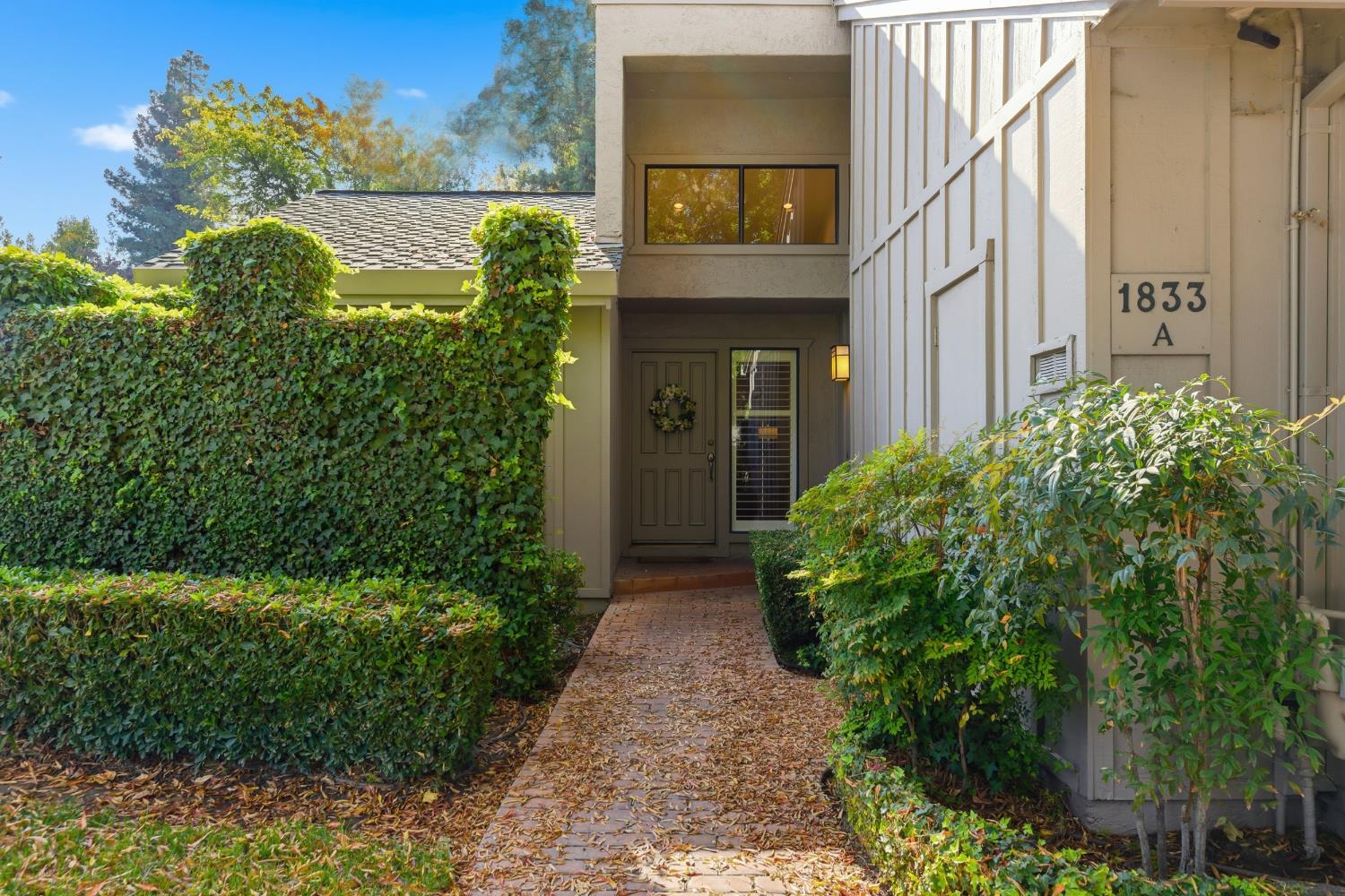 1833 Edgebrook Drive, Unit A Modesto, CA 95354 - Photo 6 of 43 a view of path with flower plants
