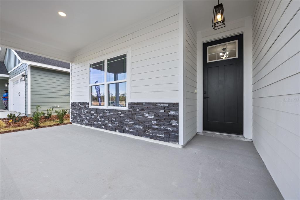 6682 Southwest 10th Lane Gainesville, FL 32607 - Photo 2 of 28 an empty room with window and hardwood floor