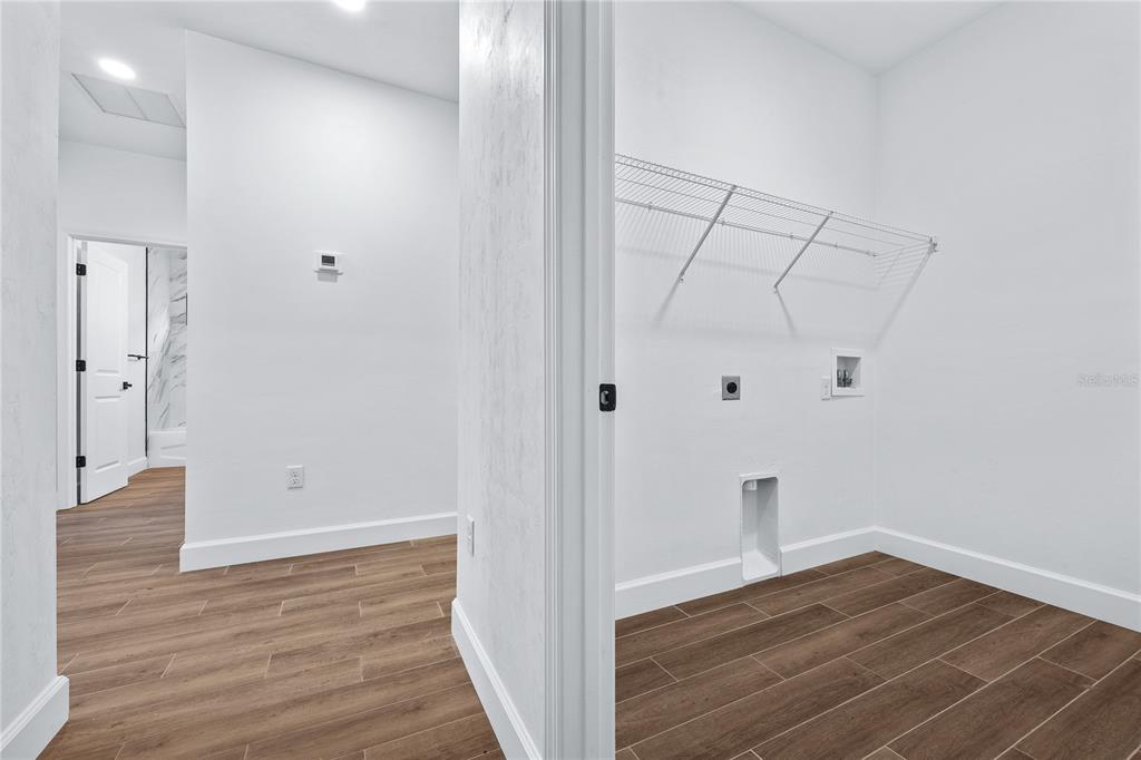 6682 Southwest 10th Lane Gainesville, FL 32607 - Photo 8 of 28 a view of room with wooden floor