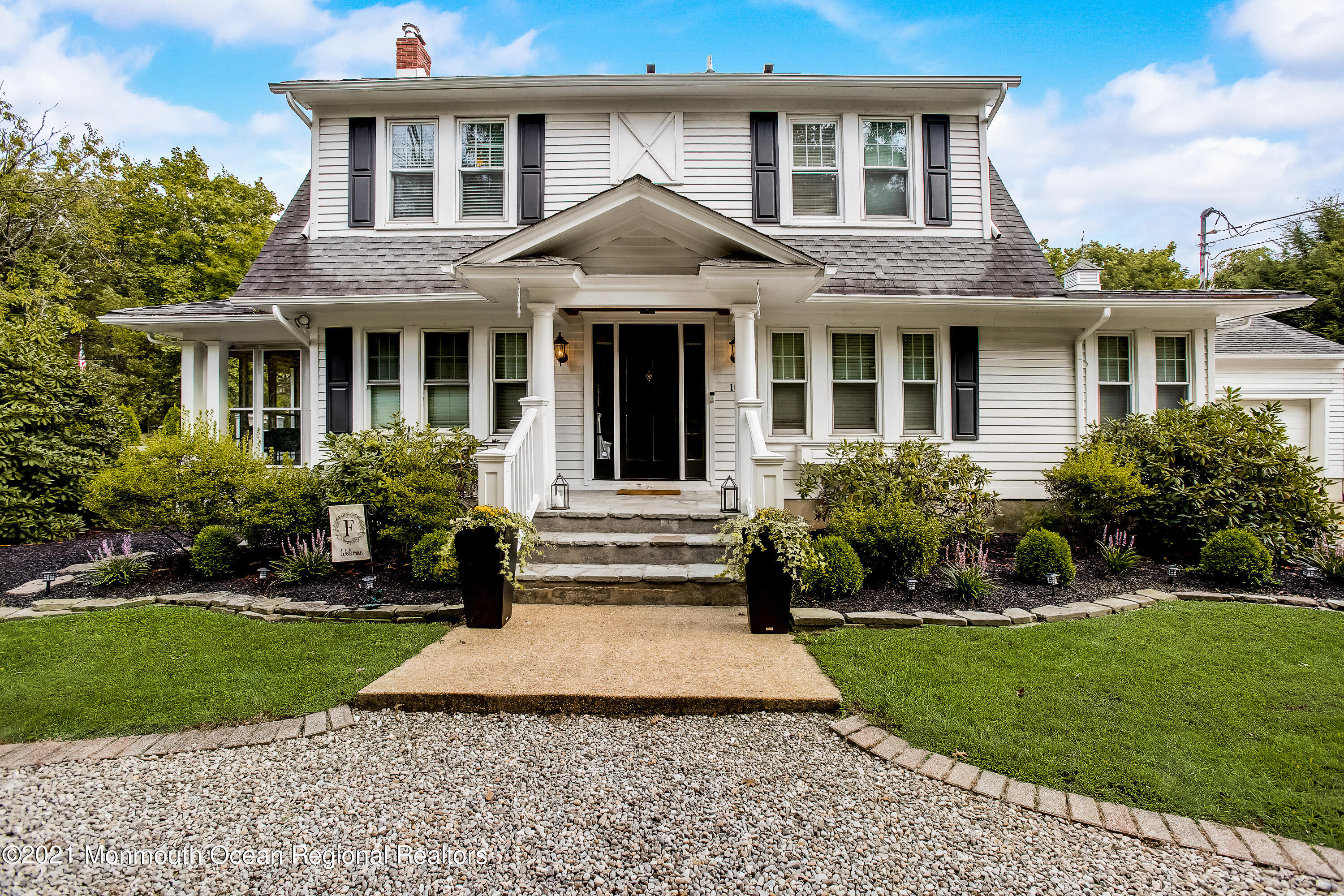 107 Brown Road Howell, NJ 07731 - Photo 1 of 43 a front view of a house with a yard and potted plants