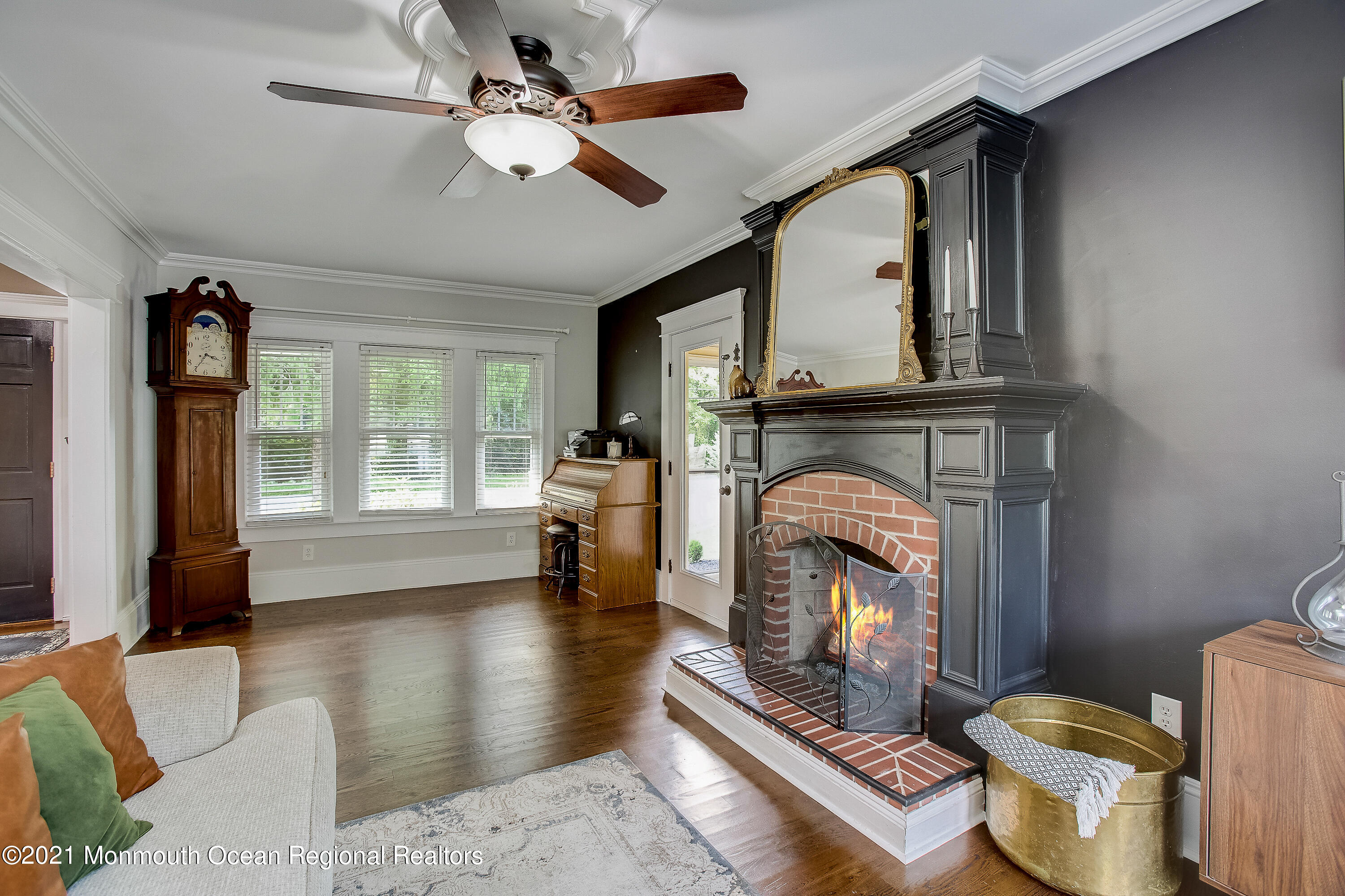 107 Brown Road Howell, NJ 07731 - Photo 12 of 43 a living room with furniture and a fireplace