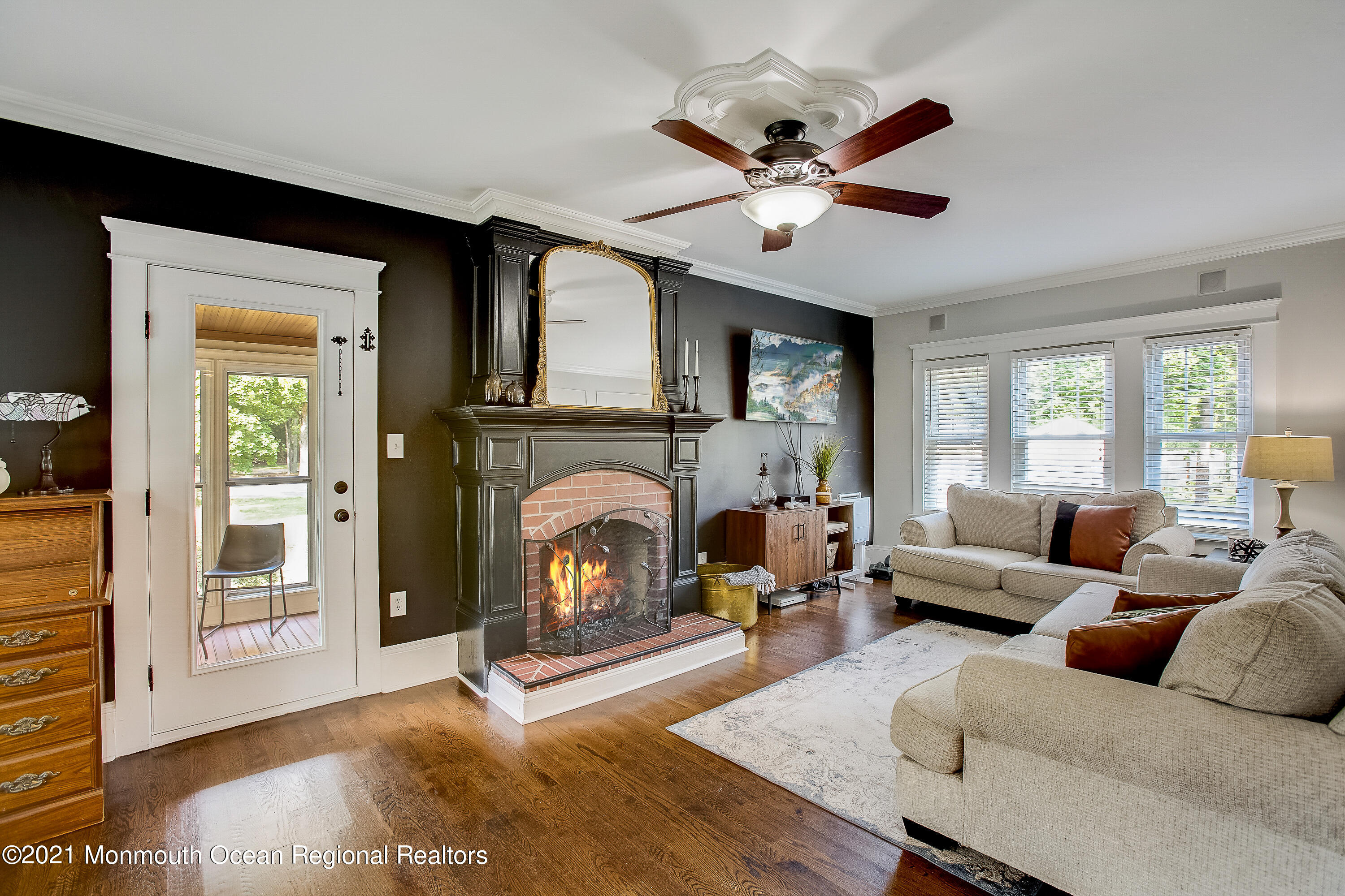 107 Brown Road Howell, NJ 07731 - Photo 13 of 43 a living room with furniture a fireplace and a window