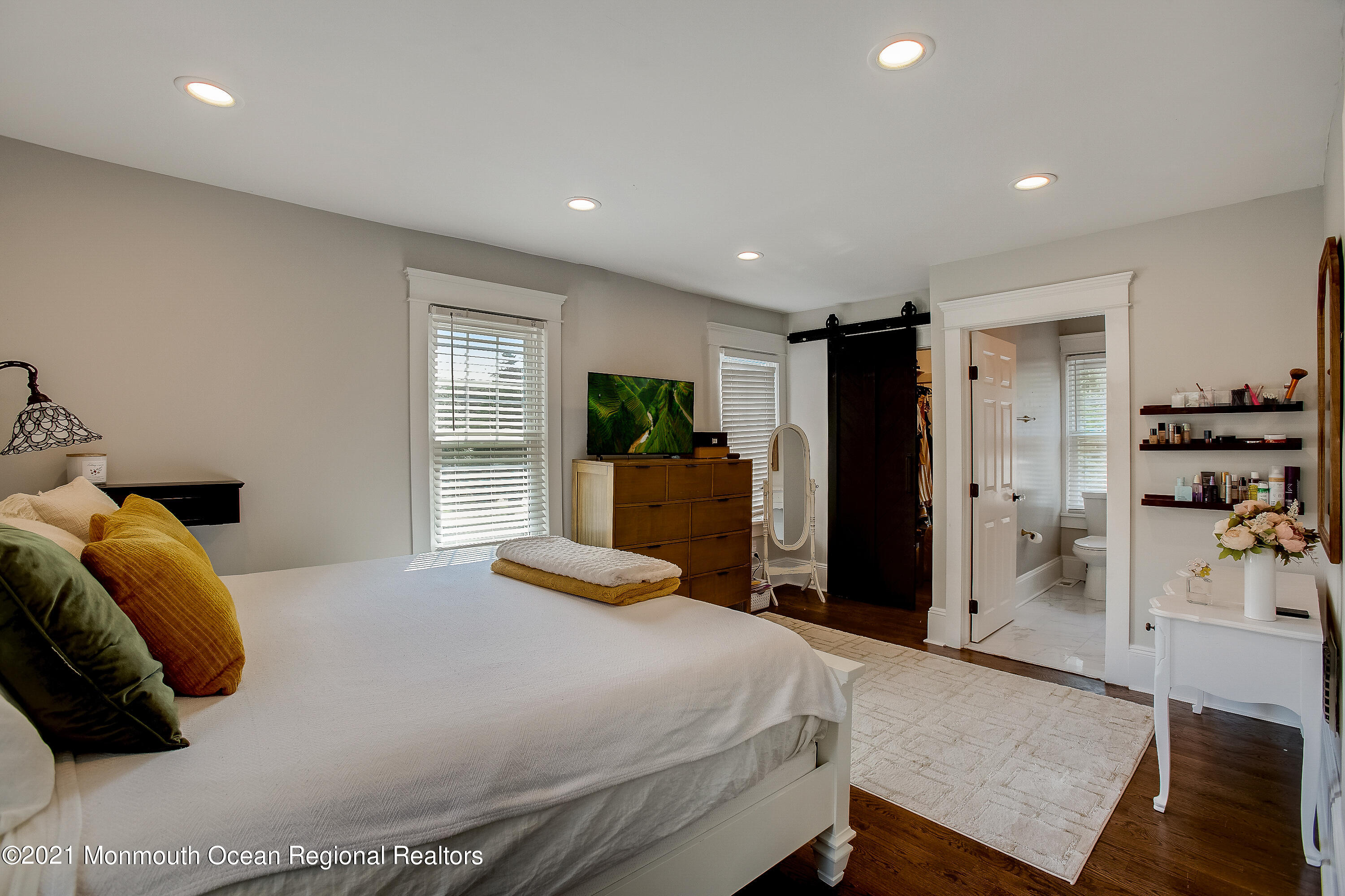 107 Brown Road Howell, NJ 07731 - Photo 19 of 43 a bedroom with a bed and a large mirror
