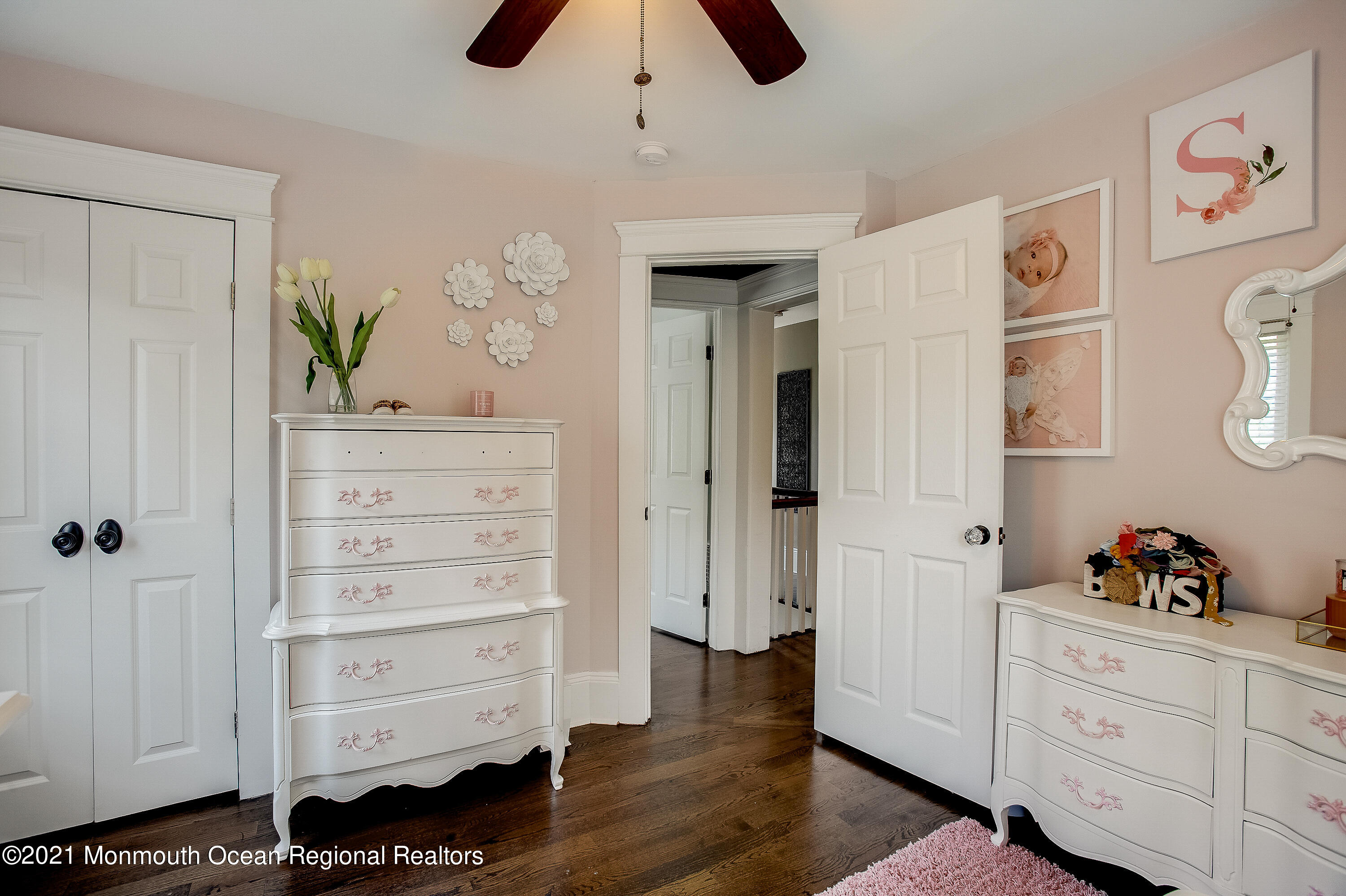 107 Brown Road Howell, NJ 07731 - Photo 23 of 43 a room with cabinets and wooden floor