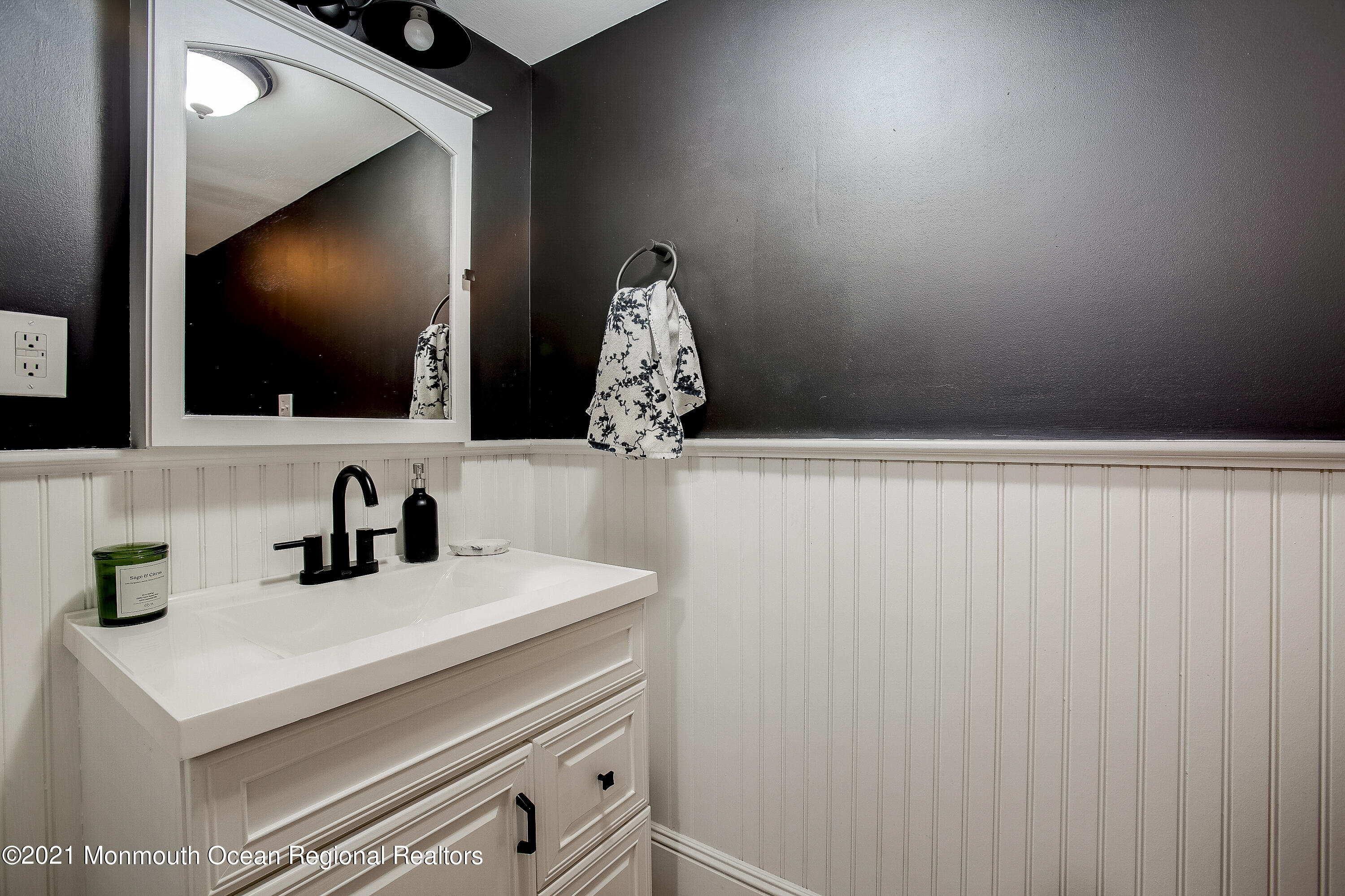 107 Brown Road Howell, NJ 07731 - Photo 26 of 43 a bathroom with a sink and a mirror