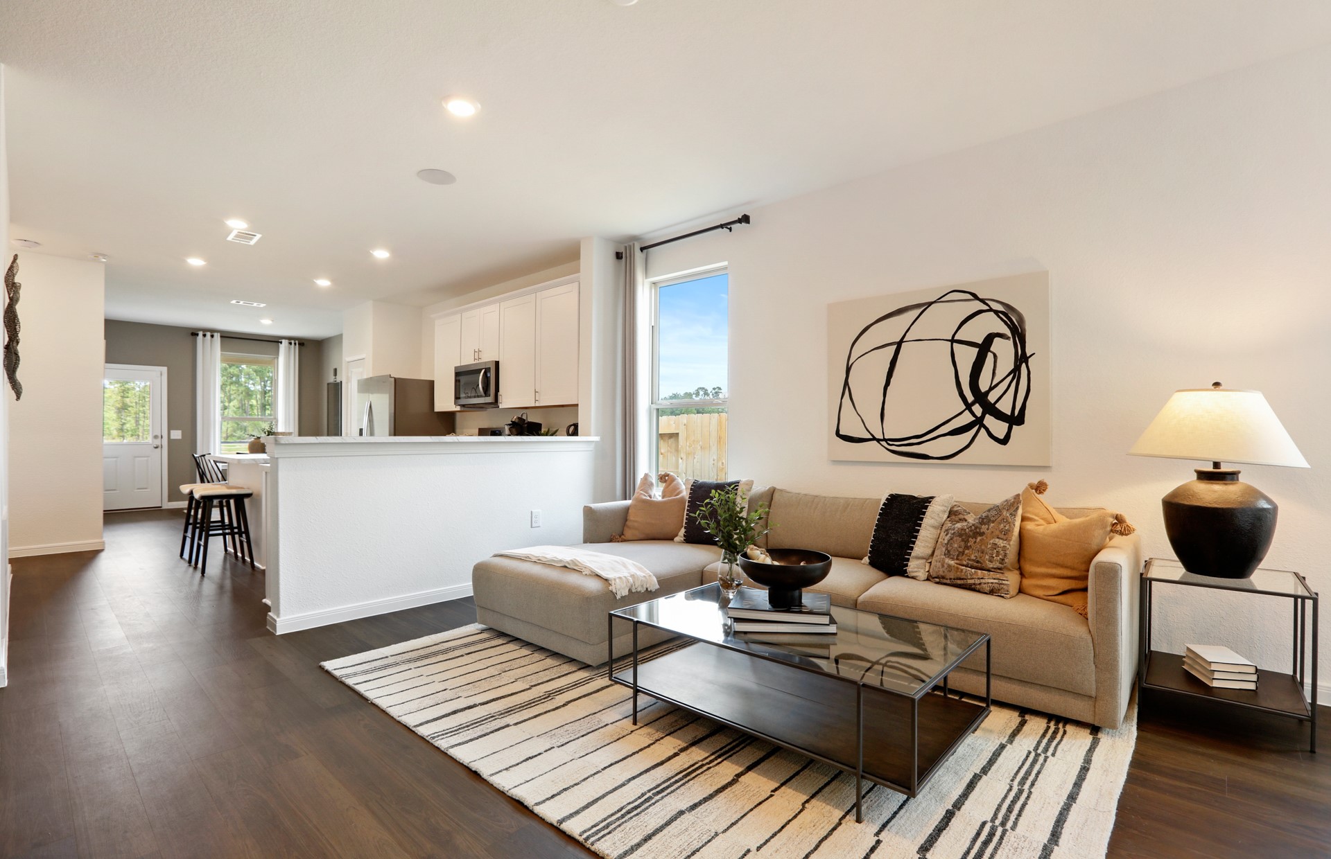 16145 Sepia Manor Street Conroe, TX 77302 - Photo 8 of 36 a living room with furniture and a wooden floor