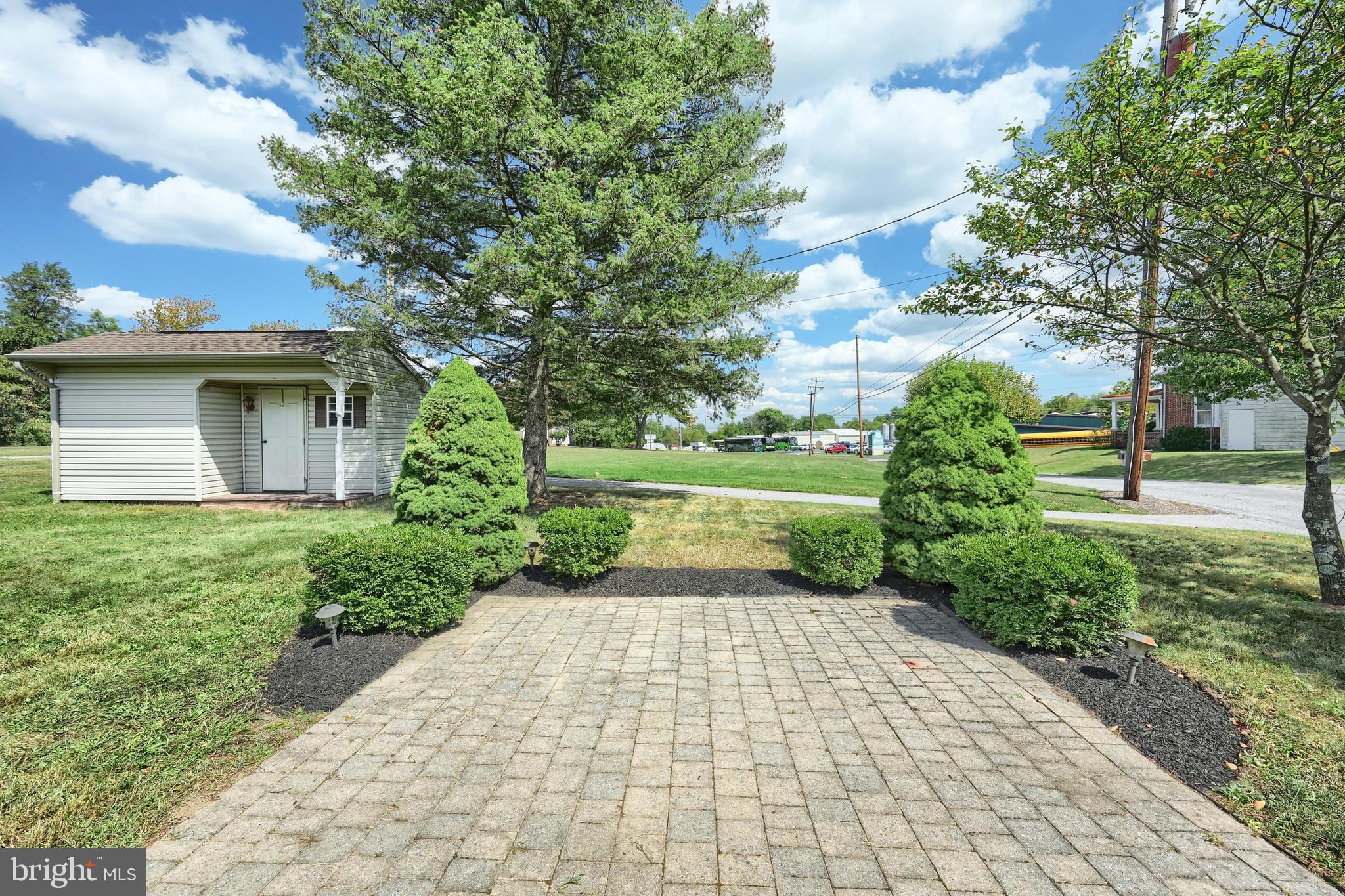 181 Harrisburg Street York Springs, PA 17372 - Photo 12 of 44 a view of a yard with plants and a large tree