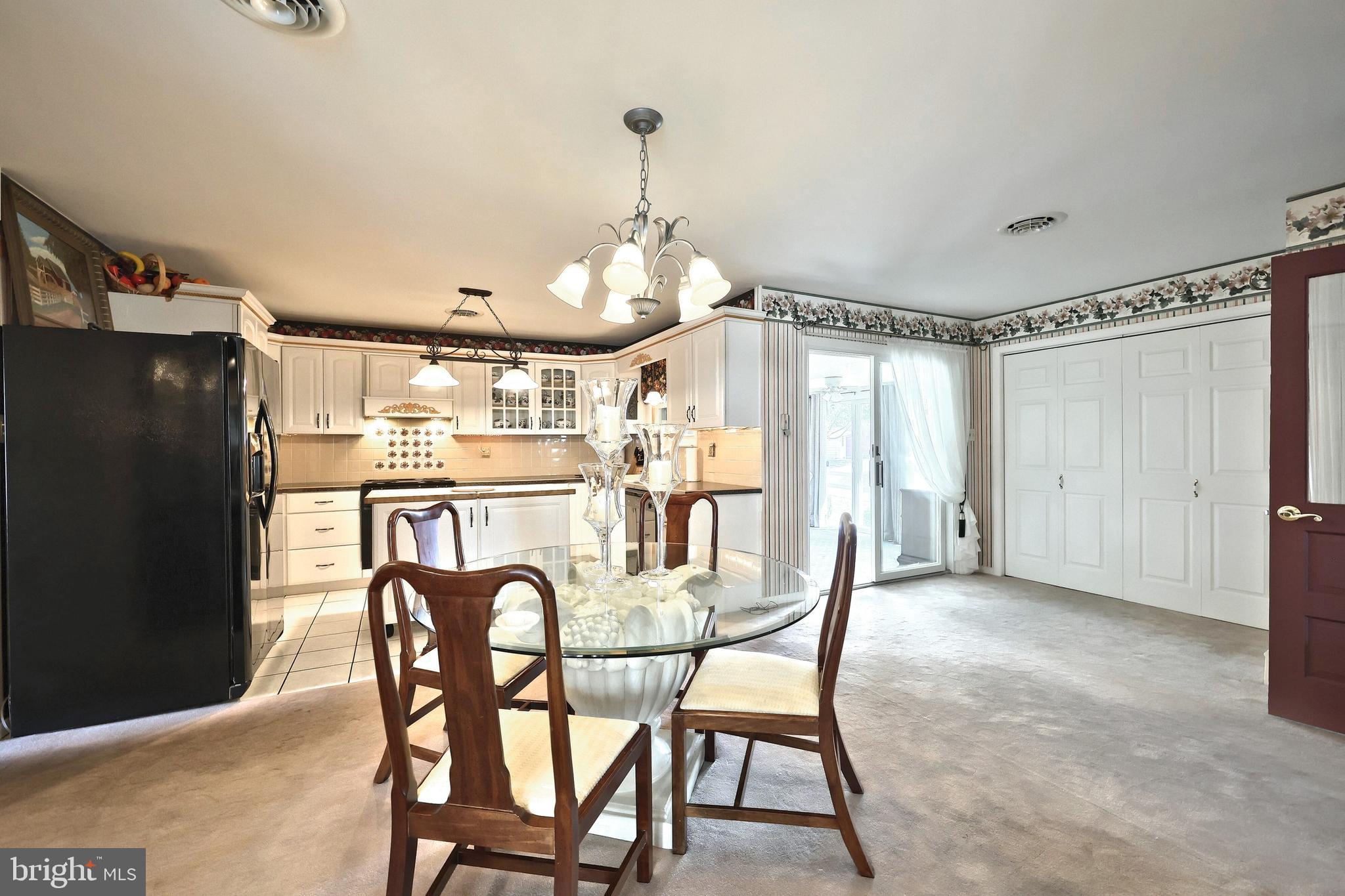 181 Harrisburg Street York Springs, PA 17372 - Photo 19 of 44 a view of a dining room with furniture and a chandelier