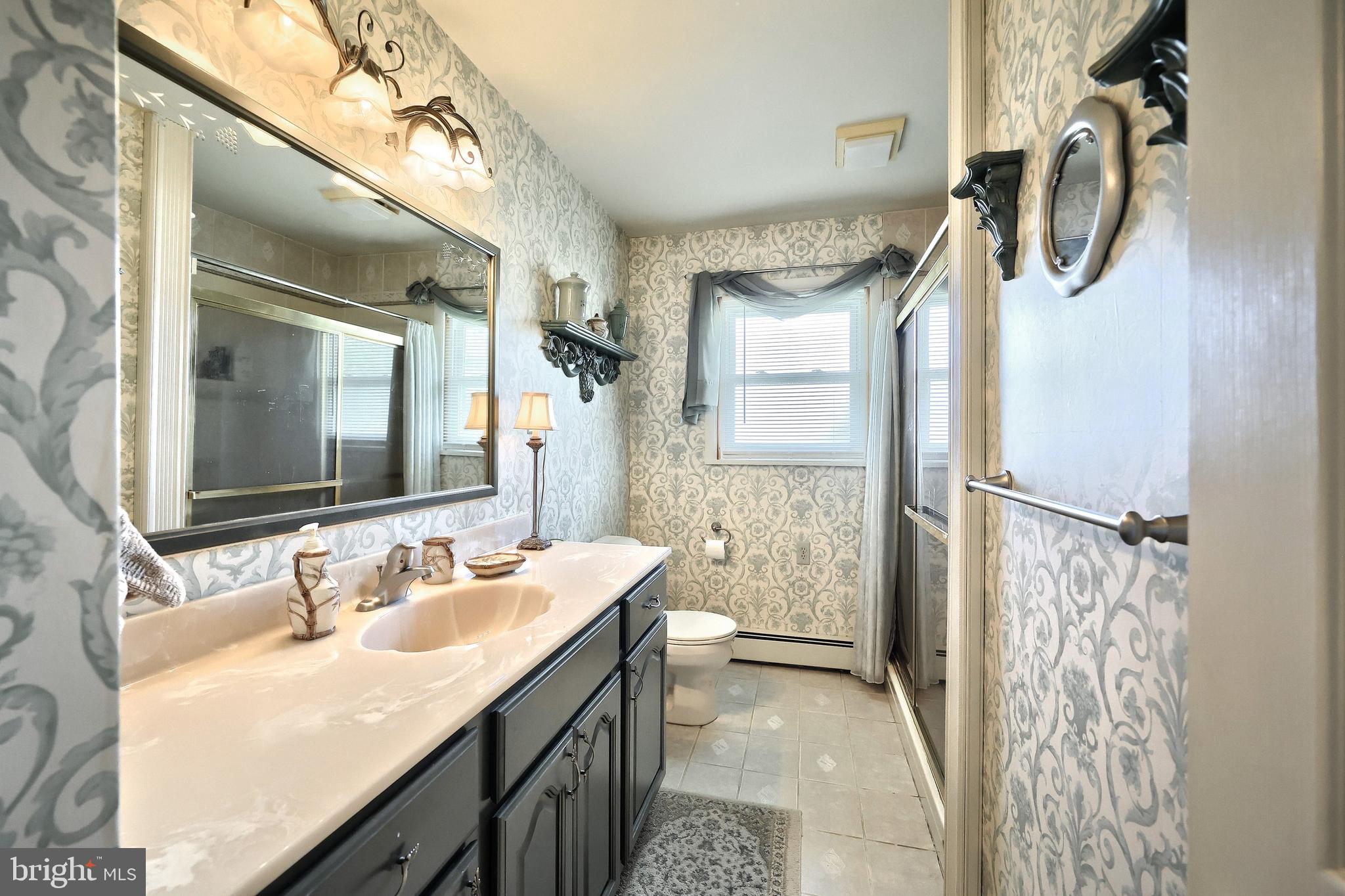 181 Harrisburg Street York Springs, PA 17372 - Photo 29 of 44 a bathroom with a double vanity sink mirror and shower