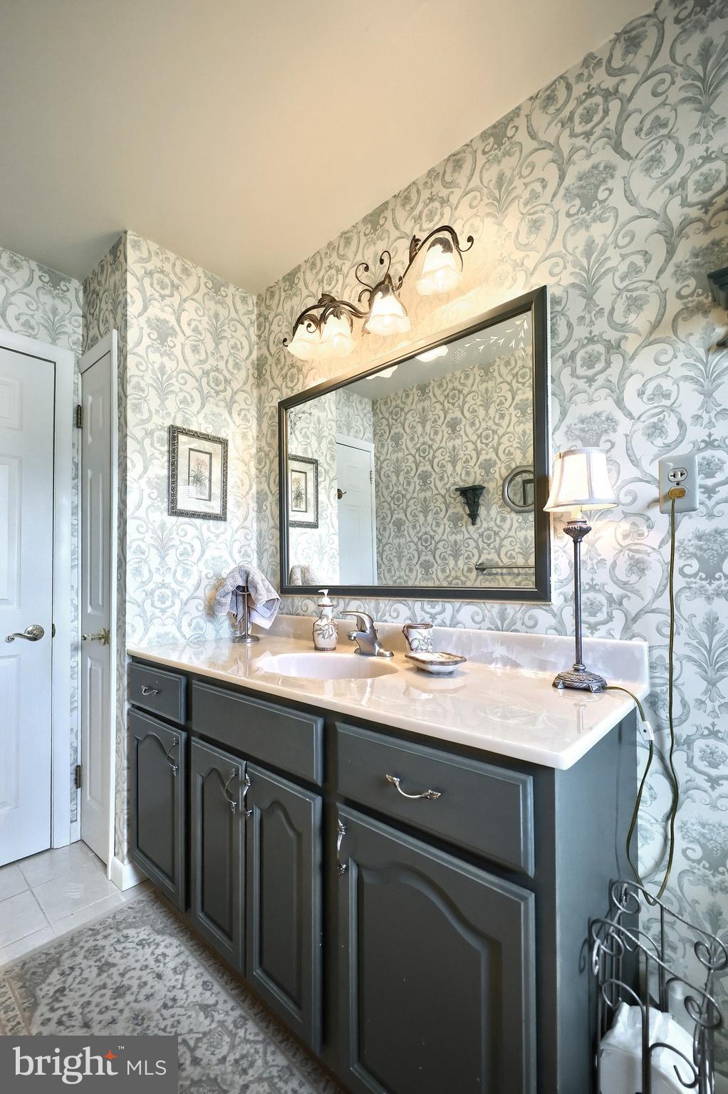 181 Harrisburg Street York Springs, PA 17372 - Photo 30 of 44 a bathroom with a granite countertop sink and a mirror