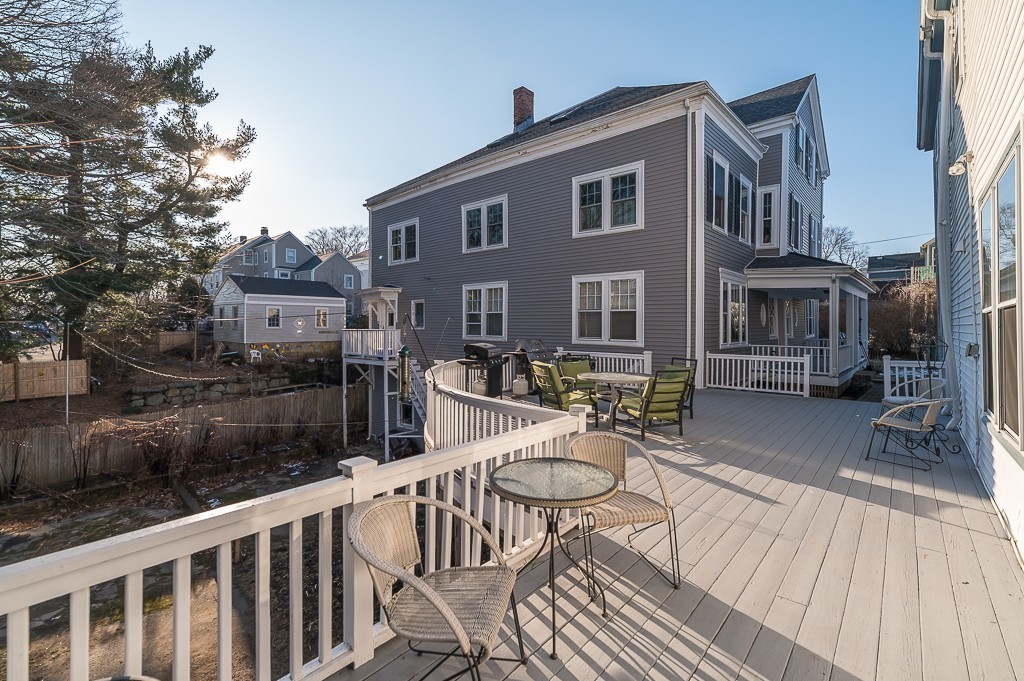 21 Thorndike Street, Unit 4 Beverly, MA 01915 - Photo 15 of 20 a view of a patio with couches table and chairs and potted plants