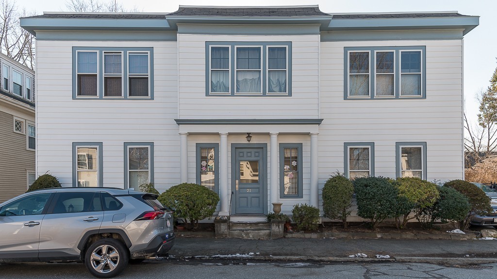 21 Thorndike Street, Unit 4 Beverly, MA 01915 - Photo 3 of 20 a front view of a house with a garden