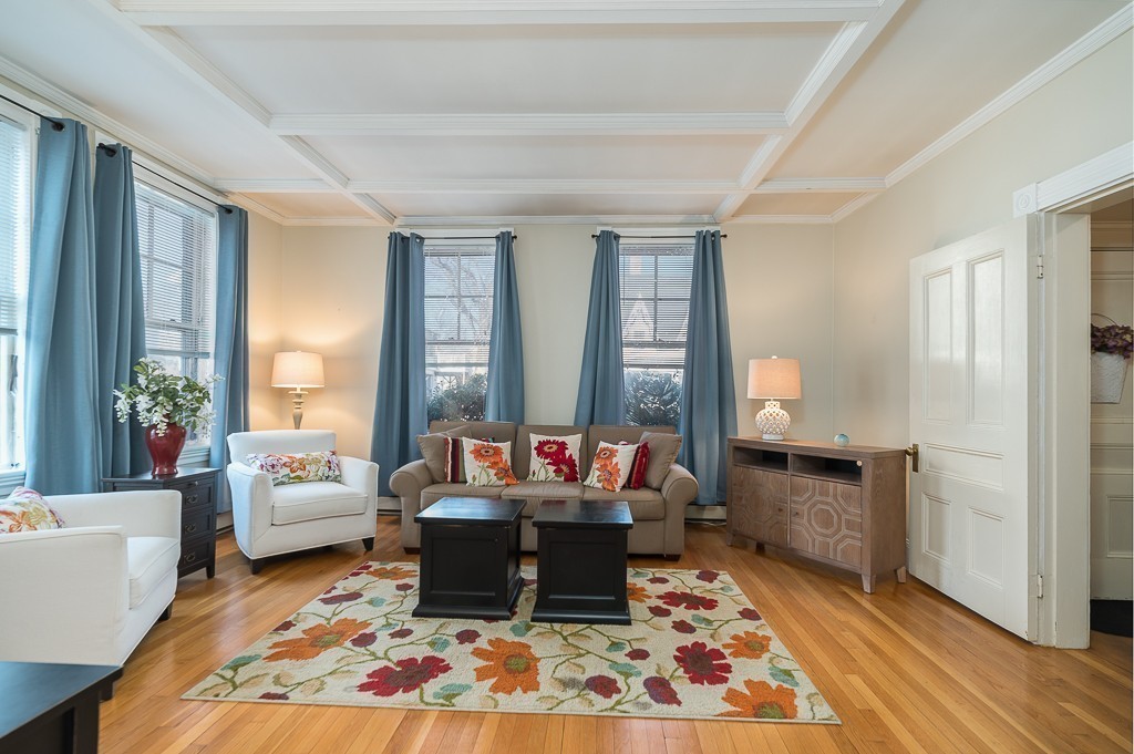 21 Thorndike Street, Unit 4 Beverly, MA 01915 - Photo 4 of 20 a living room with furniture and a rug
