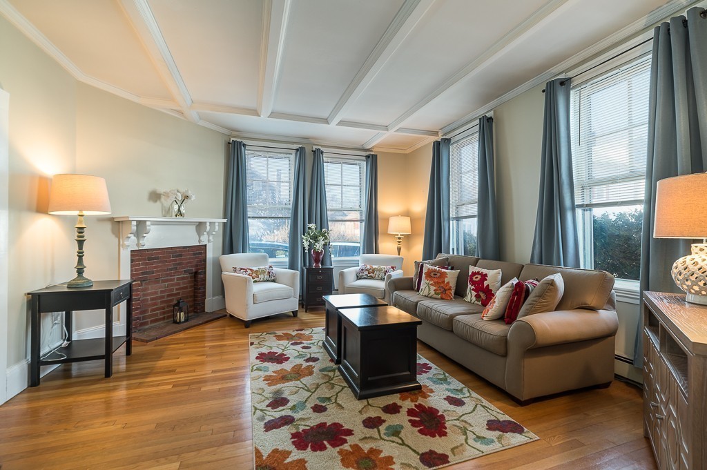 21 Thorndike Street, Unit 4 Beverly, MA 01915 - Photo 5 of 20 a living room with furniture and a large window