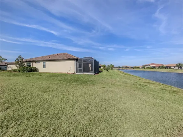 a house view with swimming pool in front of it