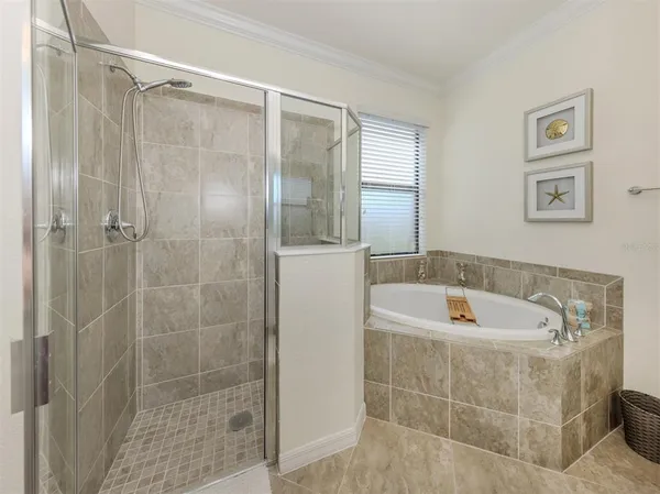 a bath room with a bath tub and a shower