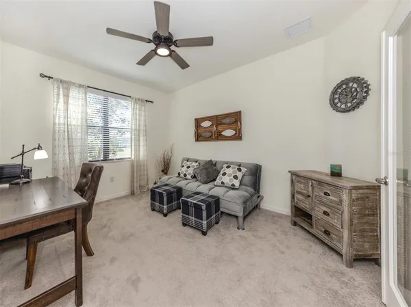 a living room with furniture and window