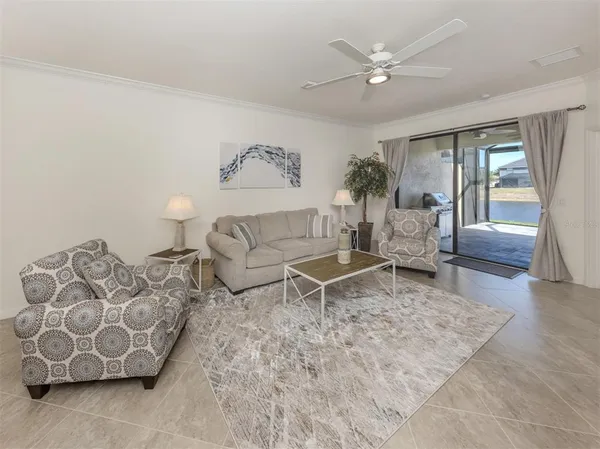 a living room with furniture and a rug