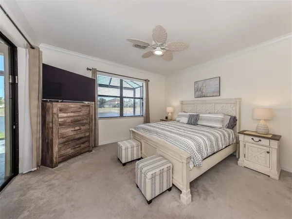 a spacious bedroom with a bed and a window