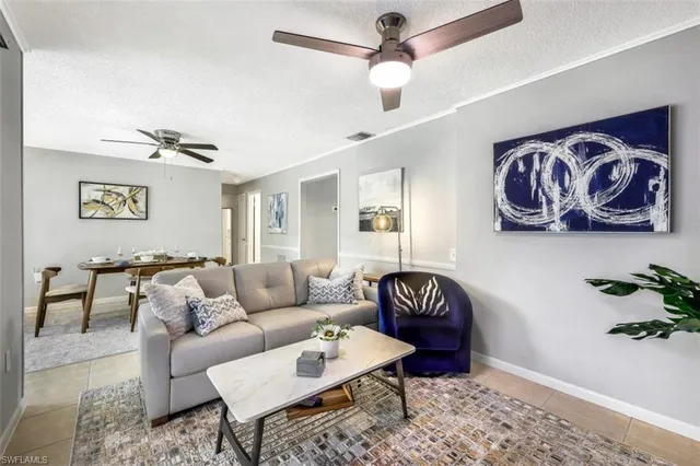 a living room with furniture and a rug