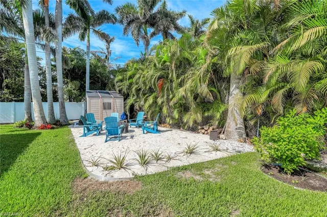 a living room with furniture a lamp and a window