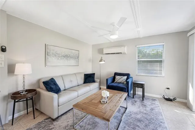 a kitchen that has a sink a stove and chairs