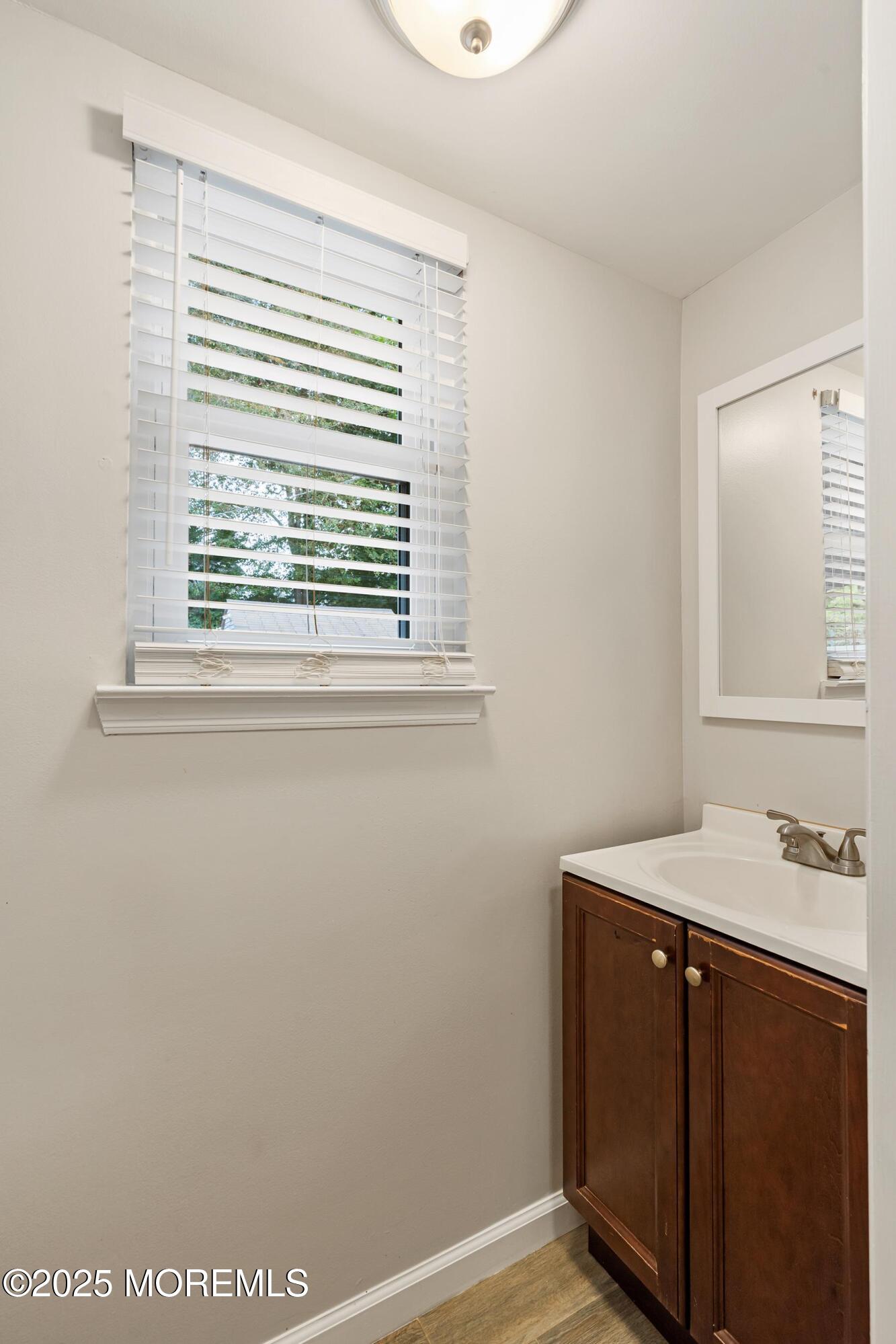 122 Moses Milch Drive Howell, NJ 07731 - Photo 11 of 15 a bathroom with a sink and a vanity
