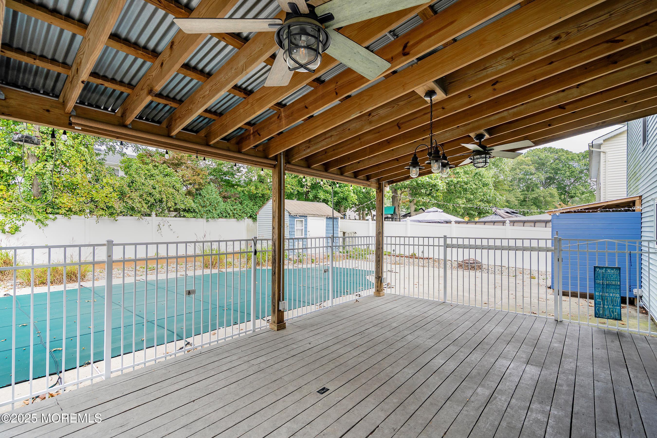 122 Moses Milch Drive Howell, NJ 07731 - Photo 13 of 15 a view of backyard with a deck and wooden floor