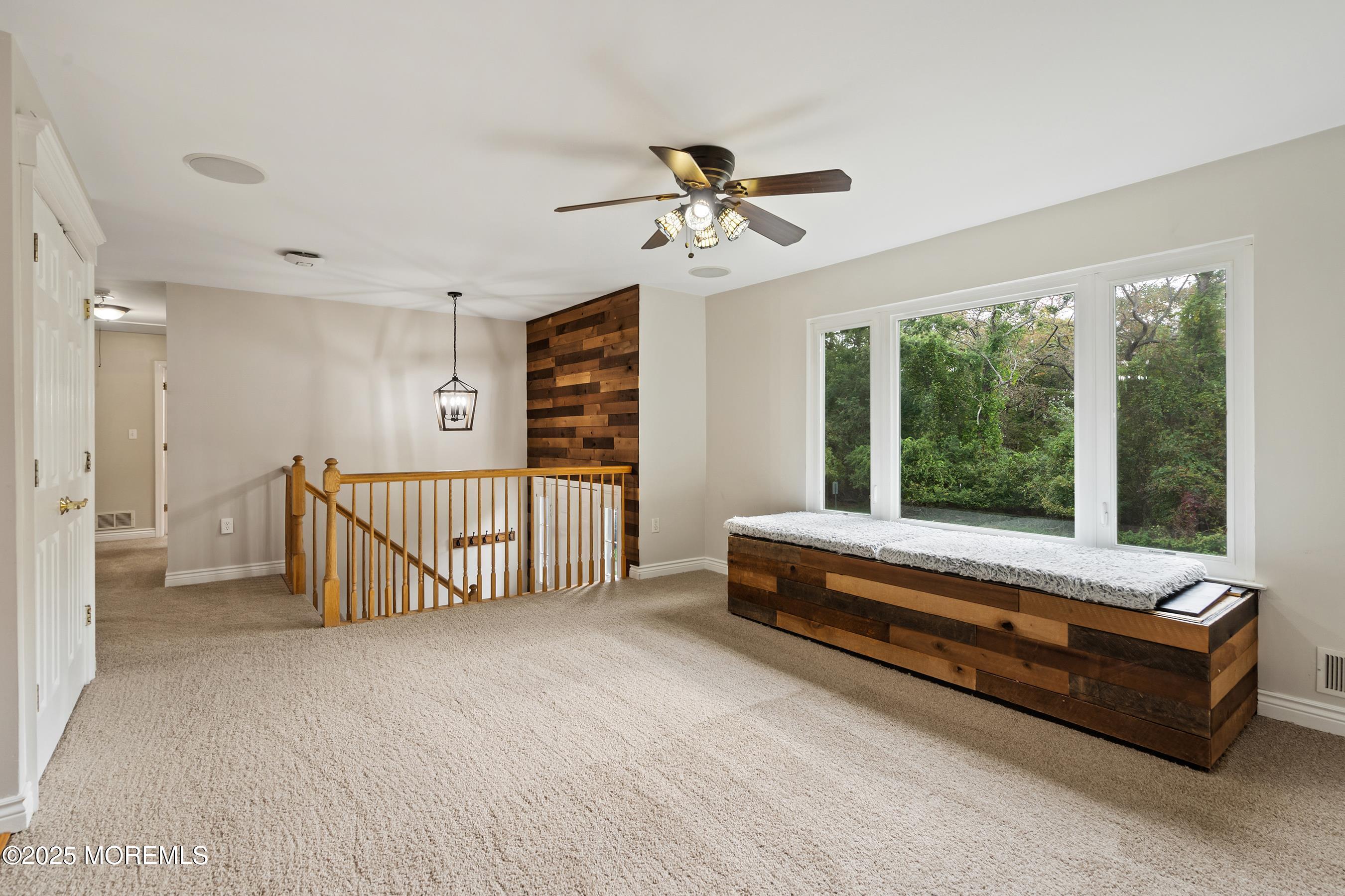 122 Moses Milch Drive Howell, NJ 07731 - Photo 2 of 15 a spacious bedroom with a bed and a chandelier