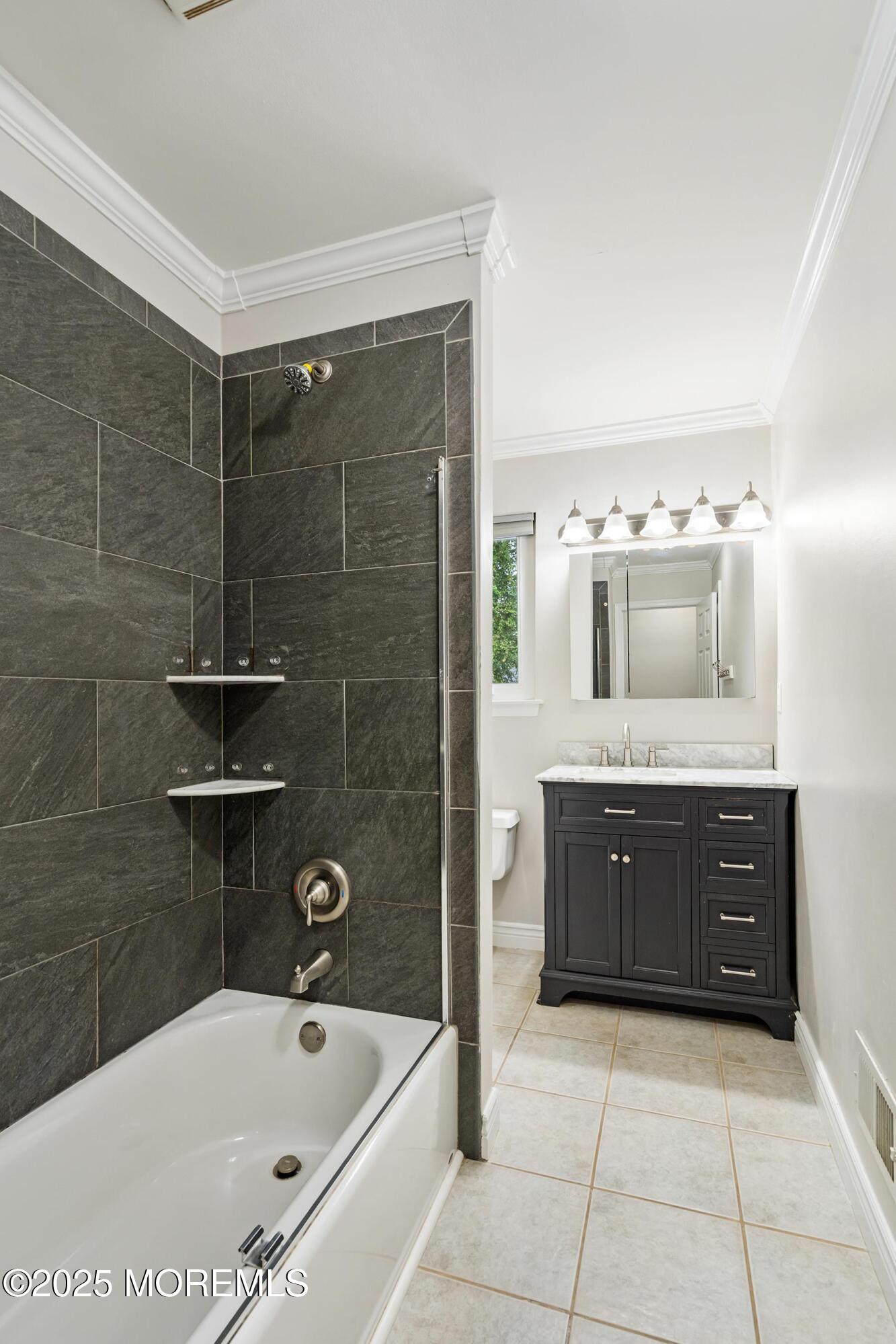 122 Moses Milch Drive Howell, NJ 07731 - Photo 8 of 15 a bathroom with a tub sink and mirror