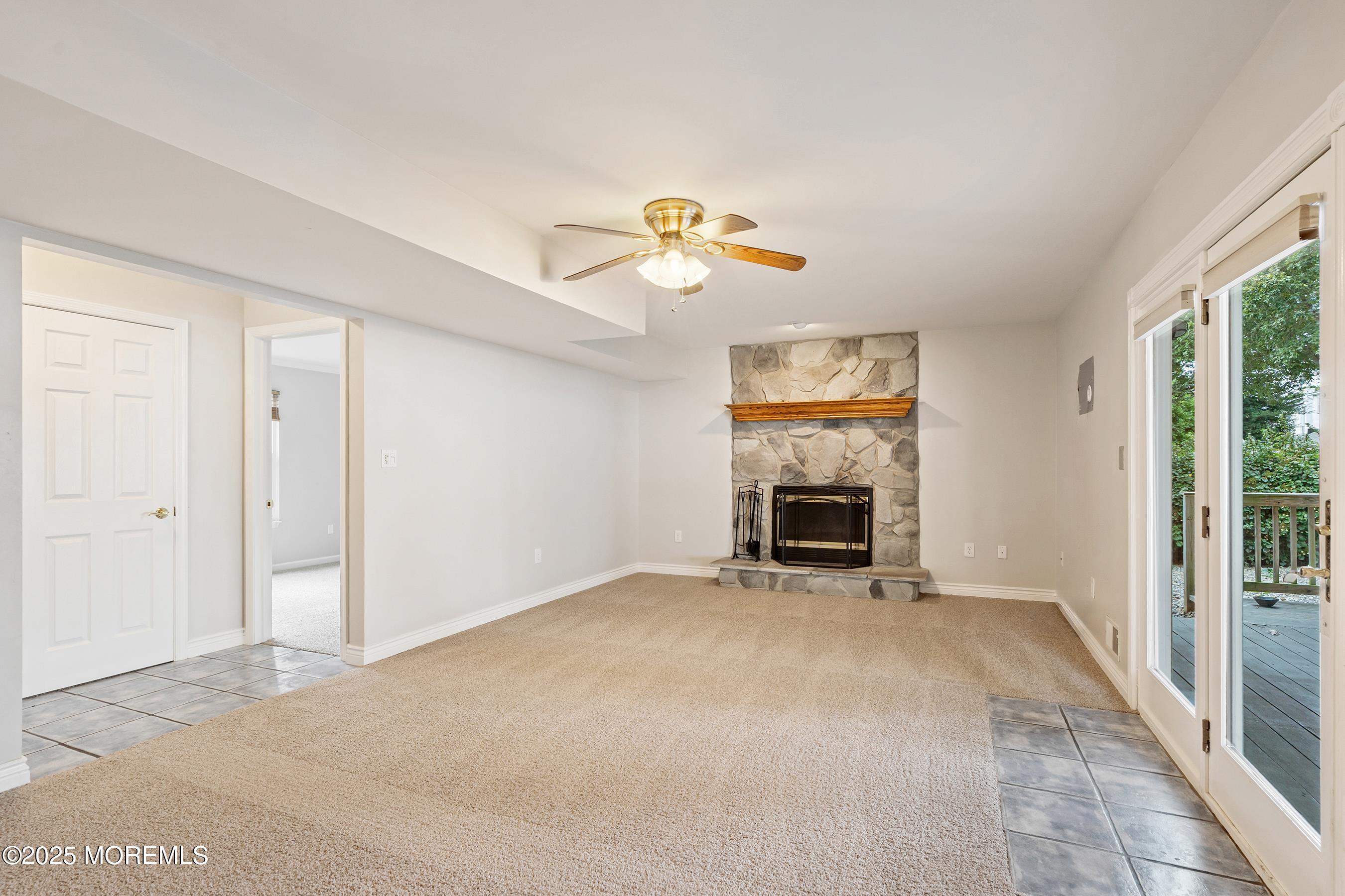 122 Moses Milch Drive Howell, NJ 07731 - Photo 10 of 15 a view of an empty room with a fireplace and a window