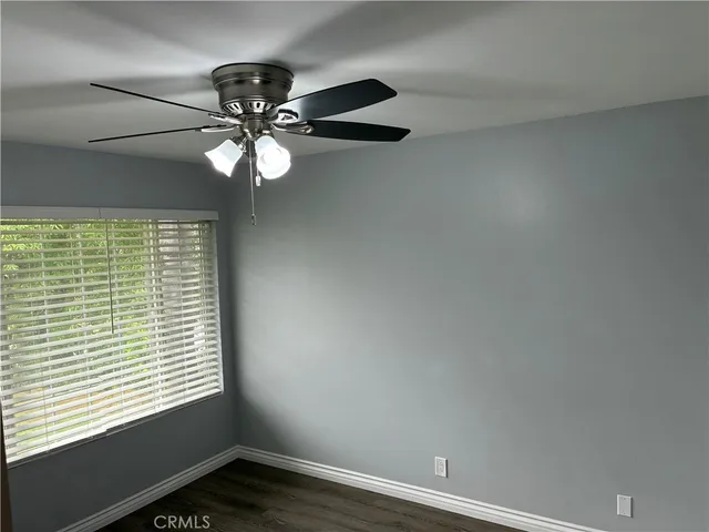 a view of a hallway with wooden shelves
