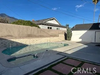 a view of a balcony with wooden floor and a mountain view