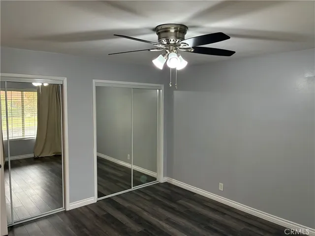 a bathroom with a granite countertop sink and mirror