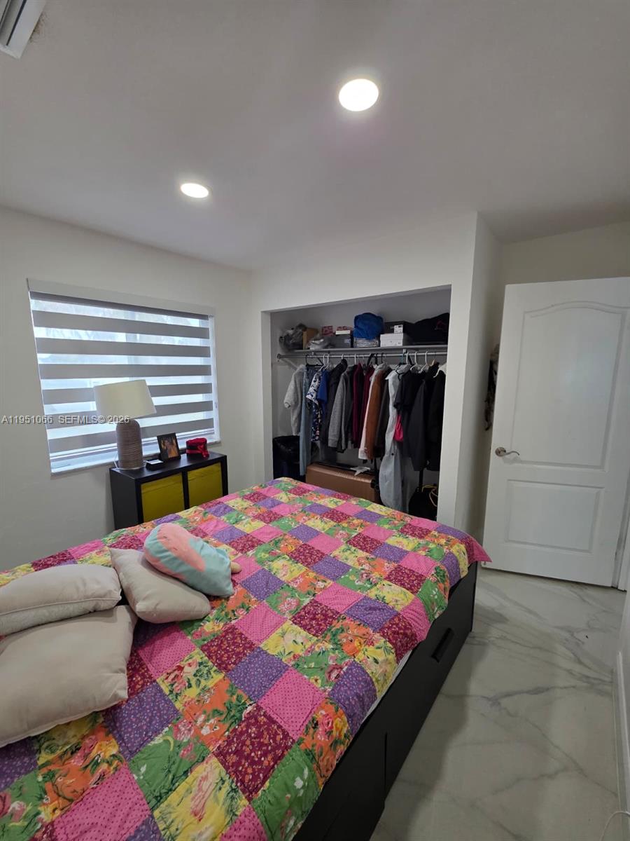 13370 Southwest 261st Terrace Homestead, FL 33032 - Photo 25 of 35 a bedroom with a bed and a closet