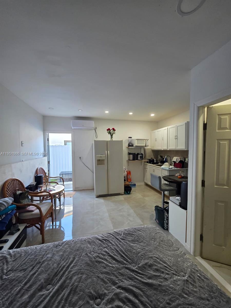 13370 Southwest 261st Terrace Homestead, FL 33032 - Photo 29 of 35 a living room with furniture and a wooden floor