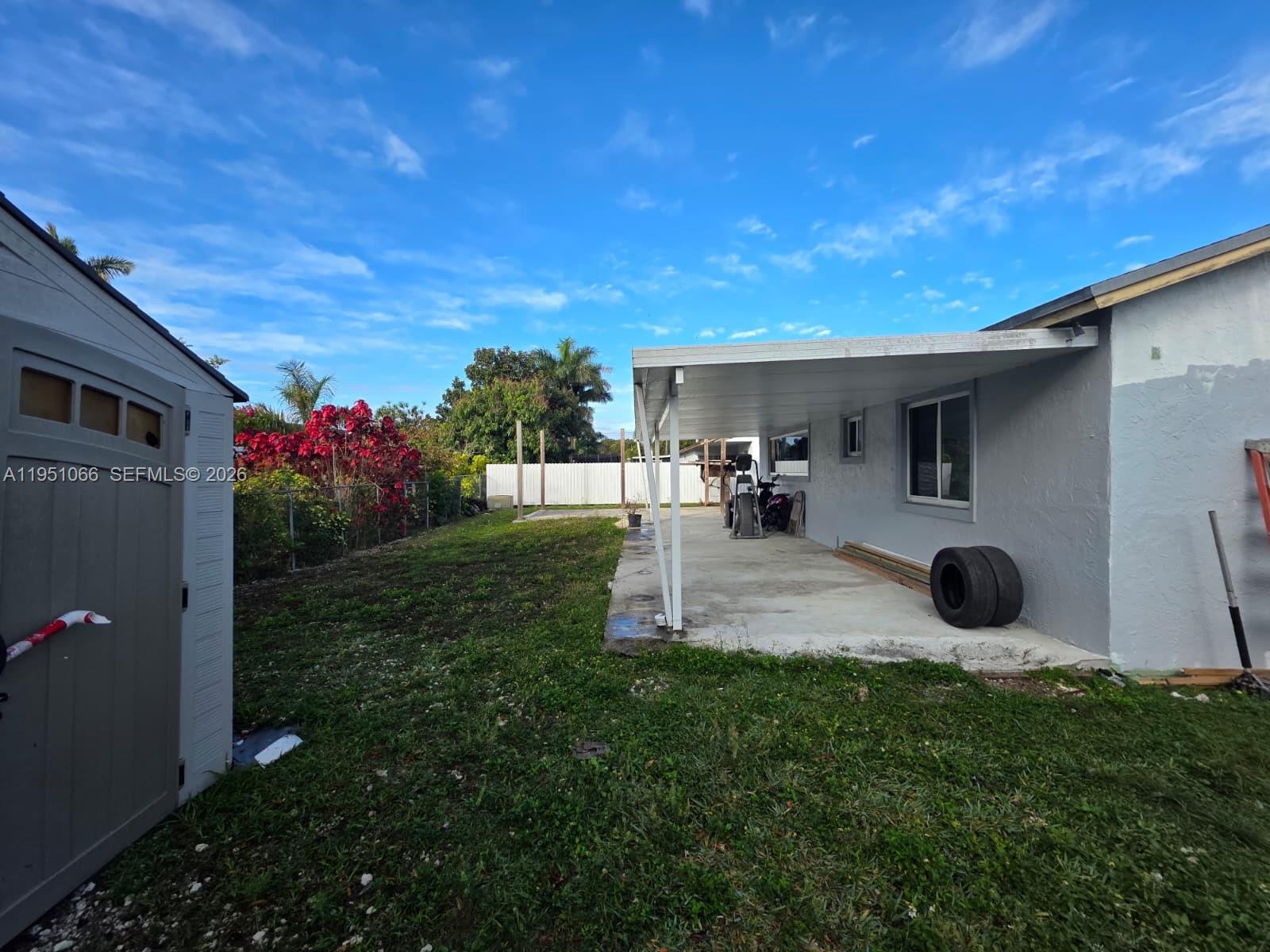 13370 Southwest 261st Terrace Homestead, FL 33032 - Photo 34 of 35 a view of a backyard with hardwood