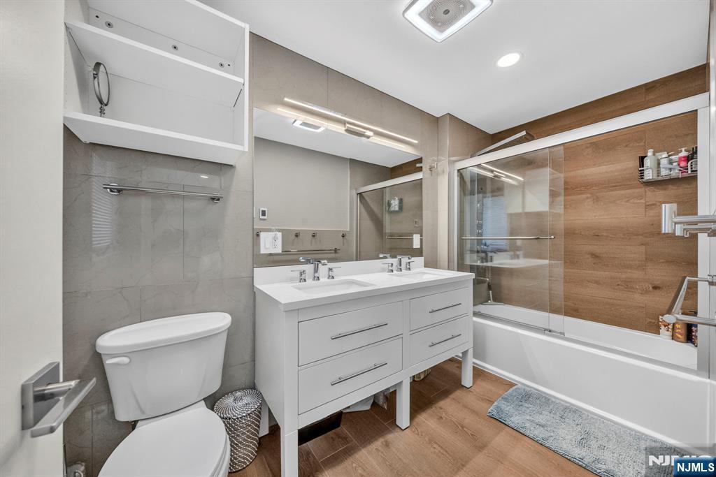 57 Hemlock Road Little Falls, NJ 07424 - Photo 28 of 50 a bathroom with a sink a toilet and shower