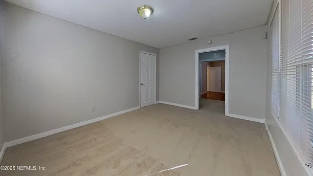 a bathroom with a toilet and a bathtub