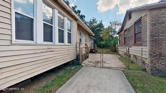 a view of backyard with green space