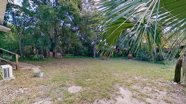 a backyard of a house with lots of green space