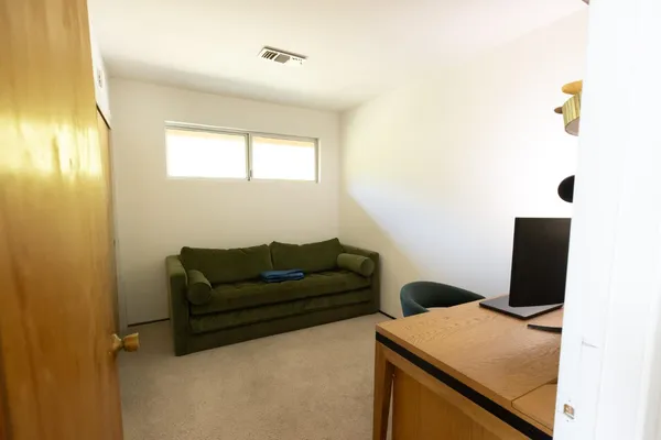 a view of a livingroom with a staircase