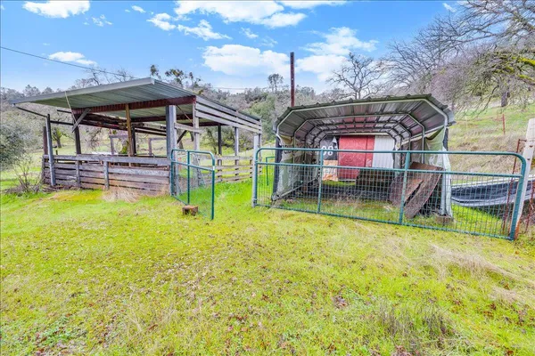 a backyard of a house with large trees