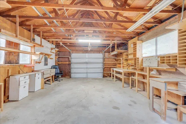 a view of river covered by trees and buildings