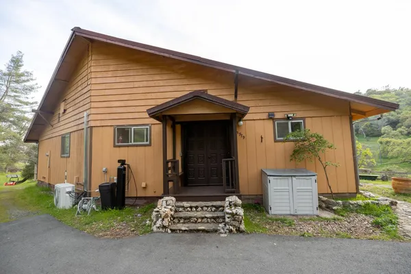 front view of a house with a small yard