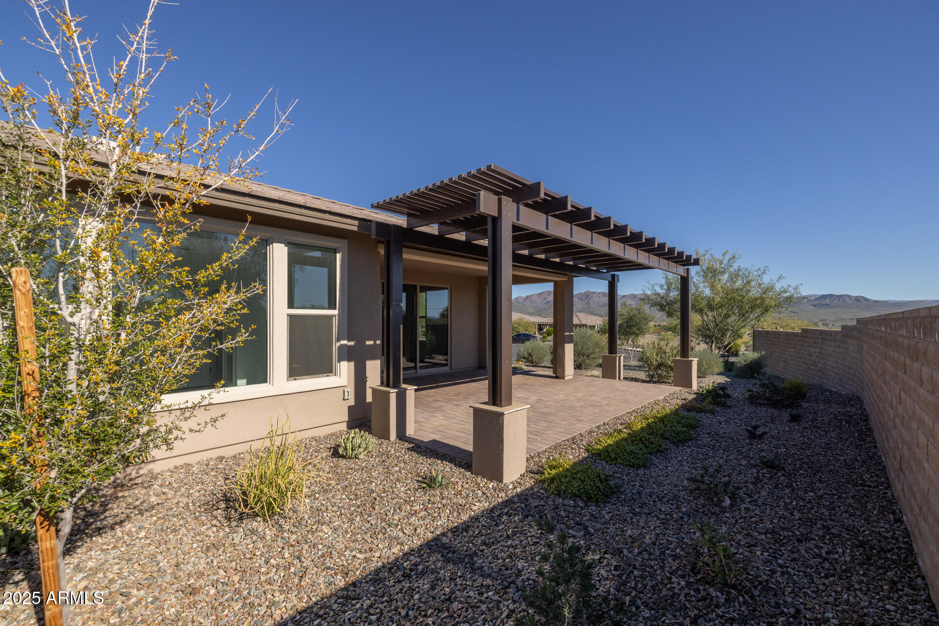18235 East Coronado Cave Court Rio Verde, AZ 85263 - Photo 10 of 13 a view of a house with a small yard and plants