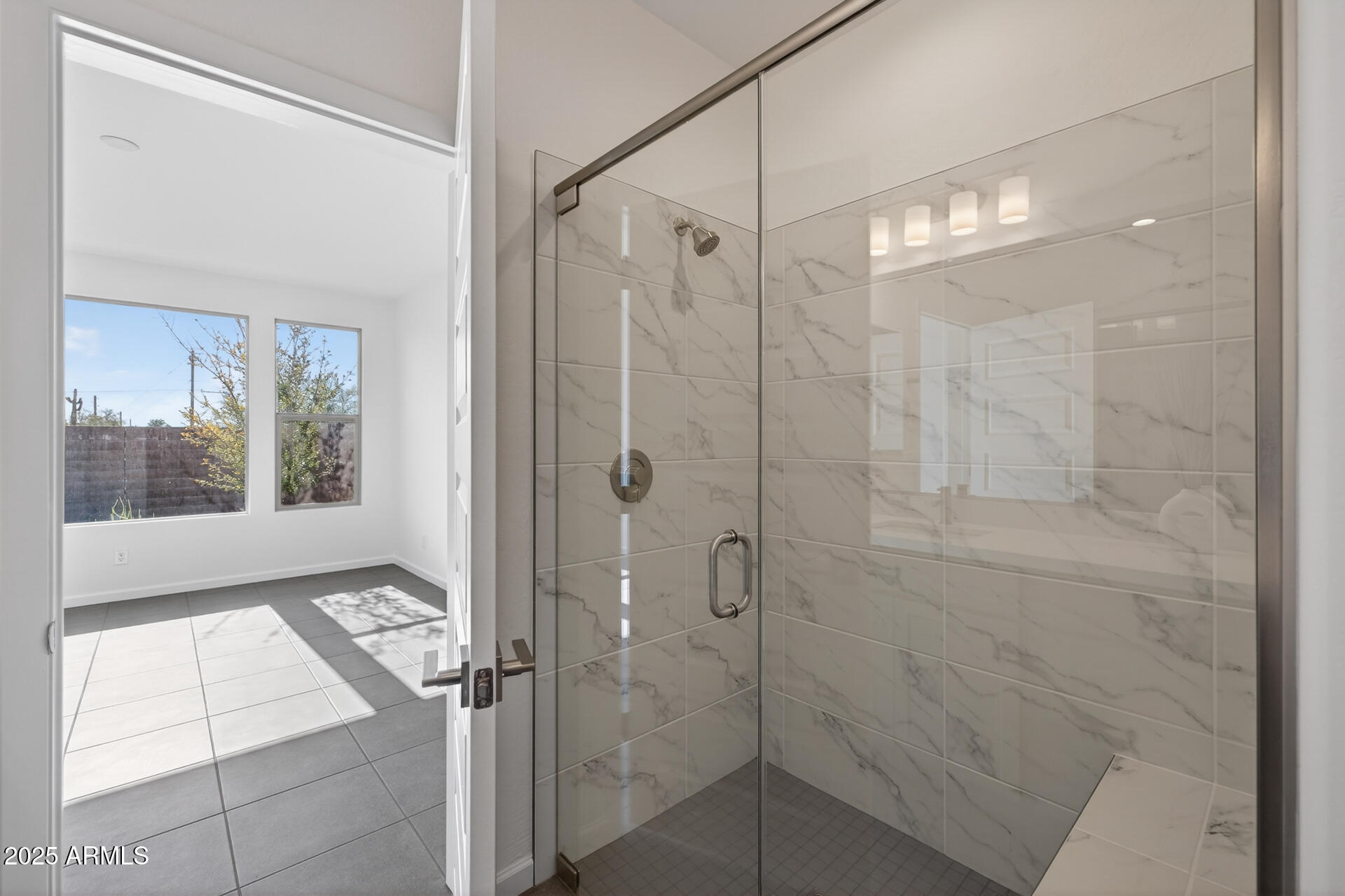 18235 East Coronado Cave Court Rio Verde, AZ 85263 - Photo 8 of 13 a bathroom with a glass shower door