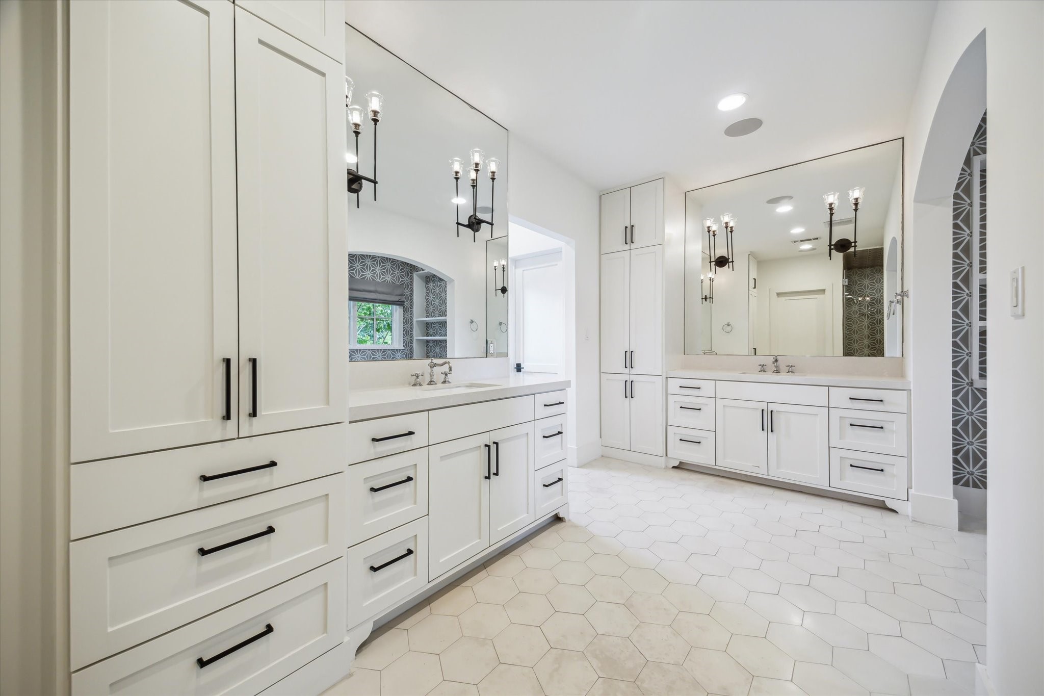3214 Westheimer Road Houston, TX 77098 - Photo 18 of 34 a spacious bathroom with double vanity sink and mirror