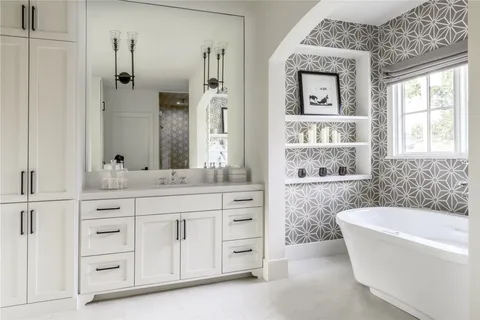 a bathroom with a granite countertop sink tub and shower